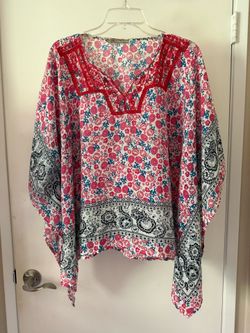 Behind the Seams Embroidered split neck tunic in pink and teal.