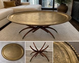 Monumental hand-engraved brass tray table with sculptural folding mahogany base