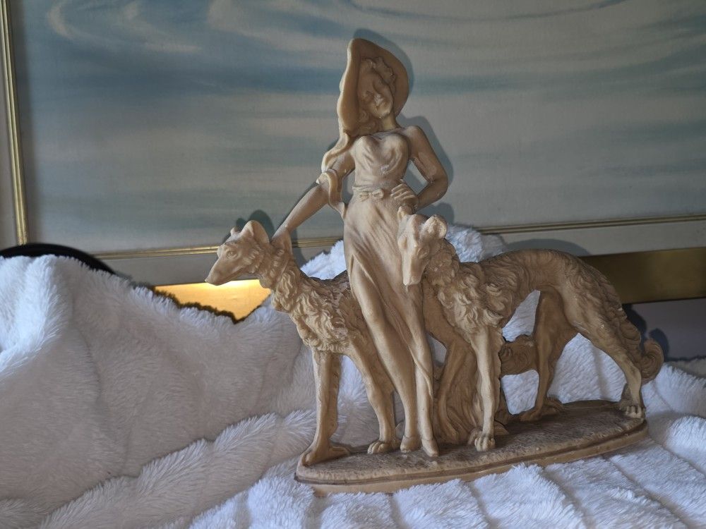 Vintage.
Lady and hound statue