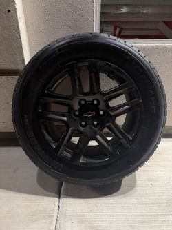 20-inch black factory OEM alloy rims with tires