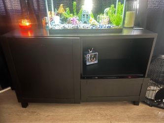Tv stand with black glass top