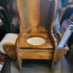 Custom-made potty chair W/ magazine rack and toilet paper holder.