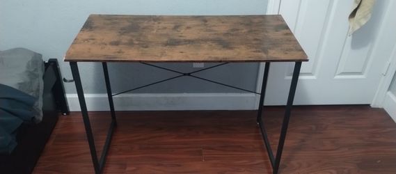 Rectangular wooden table with metal frame