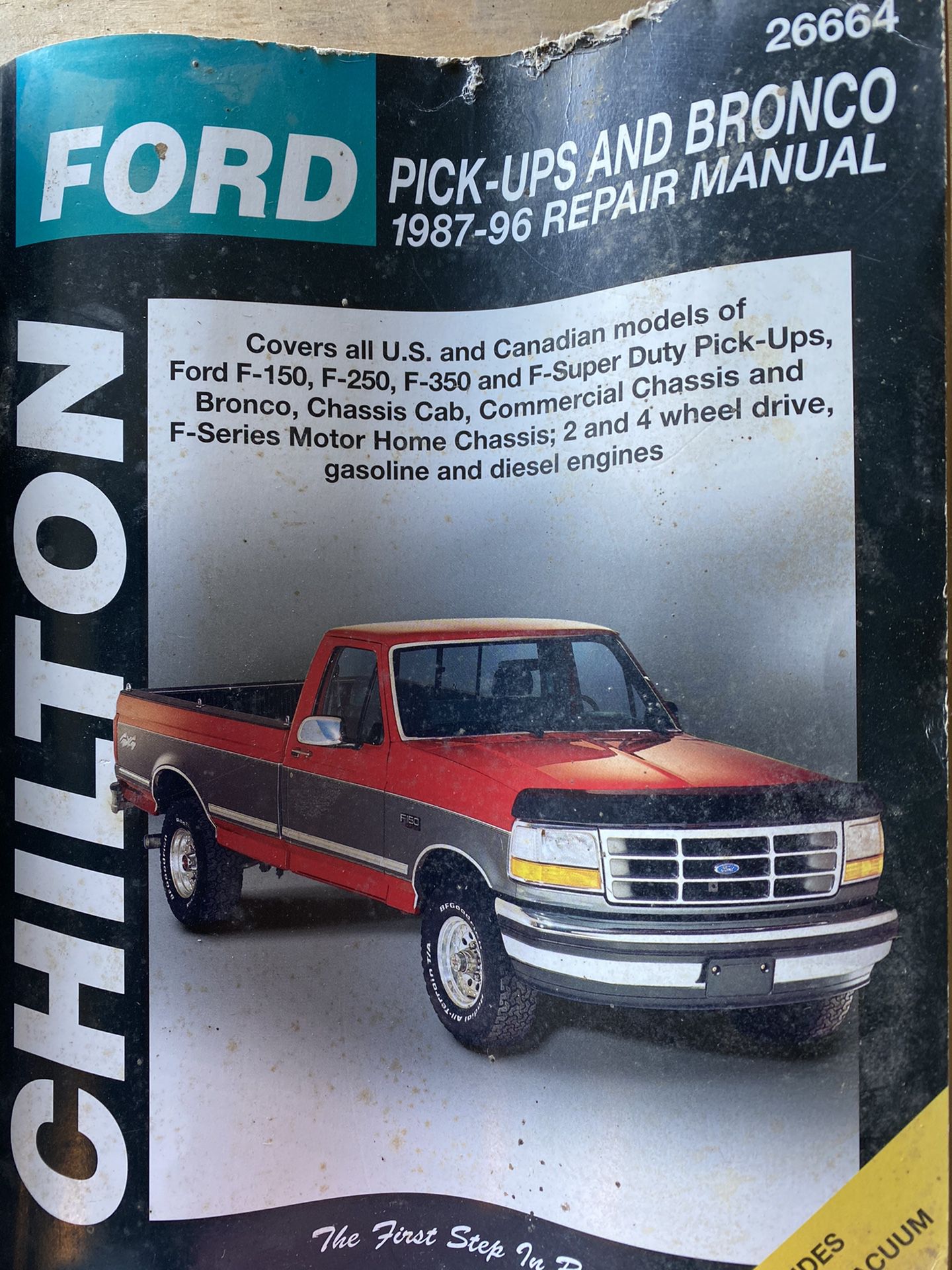 Older Ford truck Chiltons and parts.