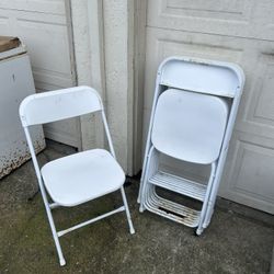 8 White Folding Chairs 