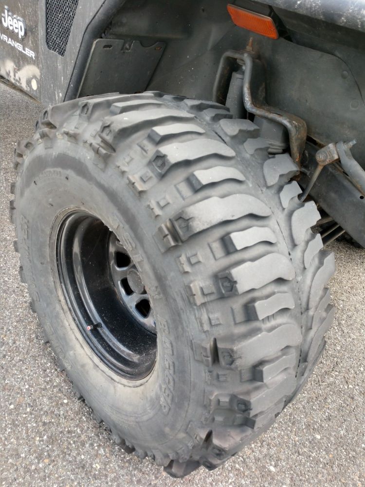 35/14.50r15 super swamper tires on Jeep rims