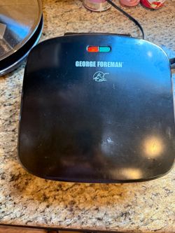 George Foreman Grill, specifically Model GRP3060B, operating at 120V, 60Hz, and 1150W