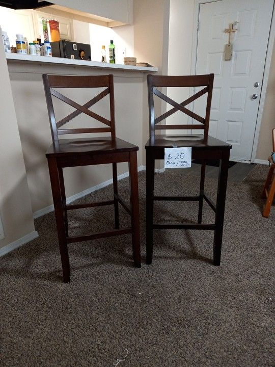Bar stool, brown, wood. Measurements 29'high 18" Wide