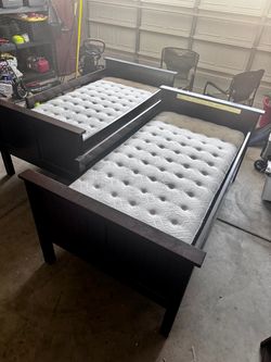 Two Twin bed frames and new mattresses