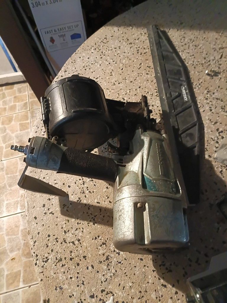 nail gun in a ladder 