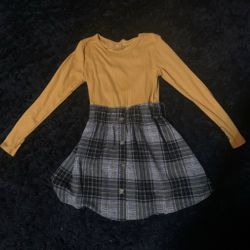 Gray and black plaid skirt with yellow top