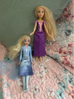 Disney princess Elsa and Rapunzel dolls
