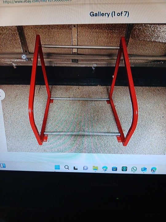 ADJUSTABLE WIDTH AND HEIGHT WALL MOUNT AUTOMOTIVE TIRE RACK