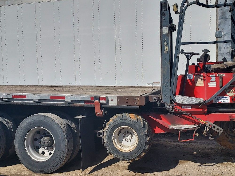 Fruehauf Trailer. Moffet Forklift