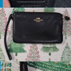 Small hand-held Coach purse