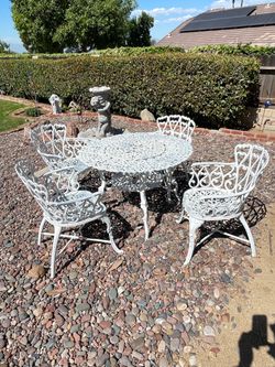 White Cast Iron Patio Table and Chair Set