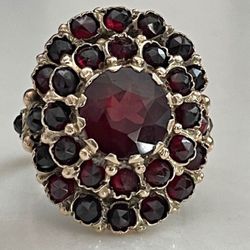 14k yellow gold ring with garnet stones Size 9 .  Gold  . Willing To Trad With Silver 