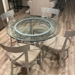 Glass Table With Four Chairs And Two Barstools.