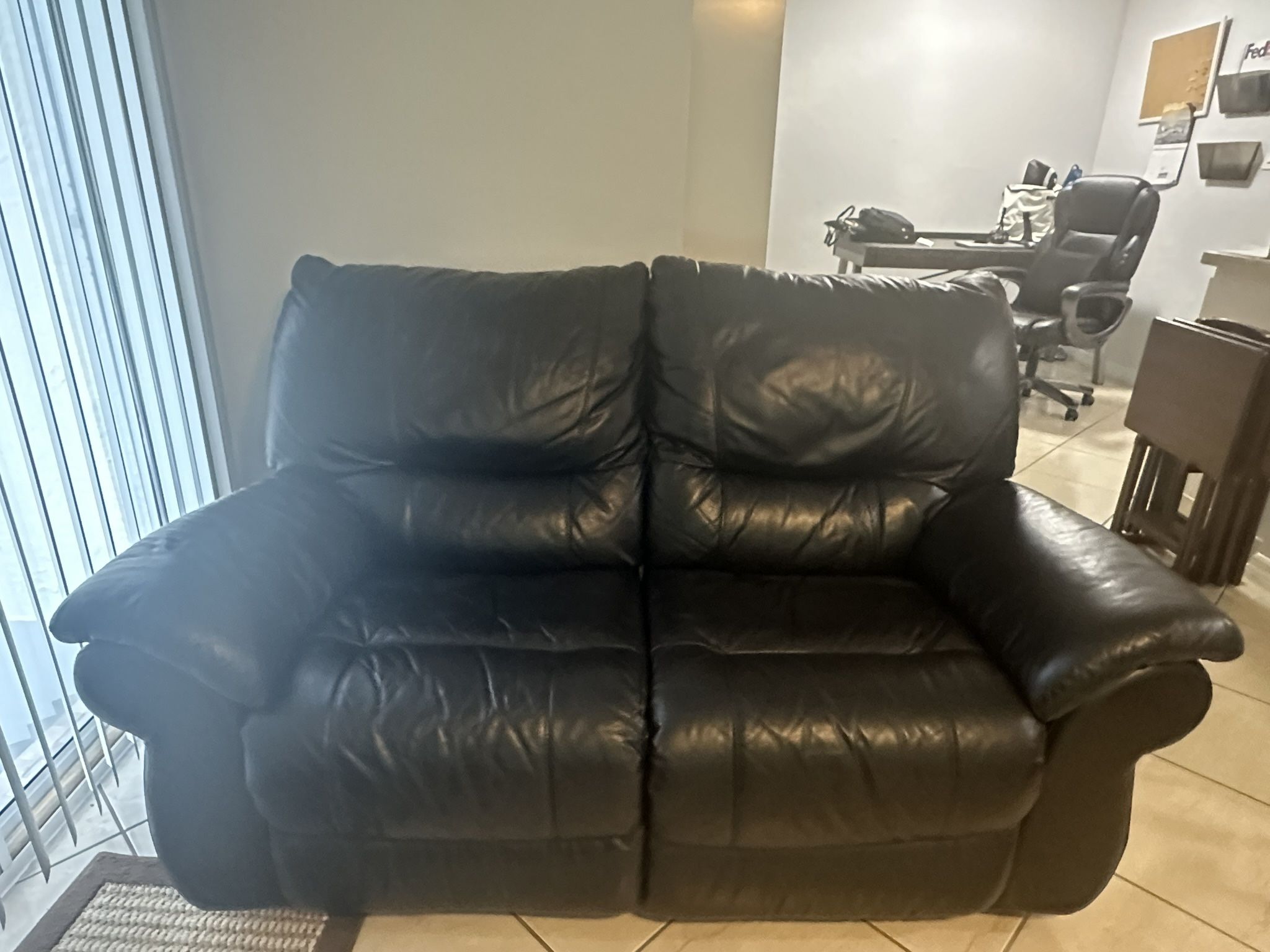 Leather reclining loveseat