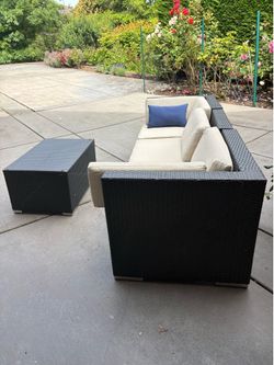 Outdoor wicker sofa and table