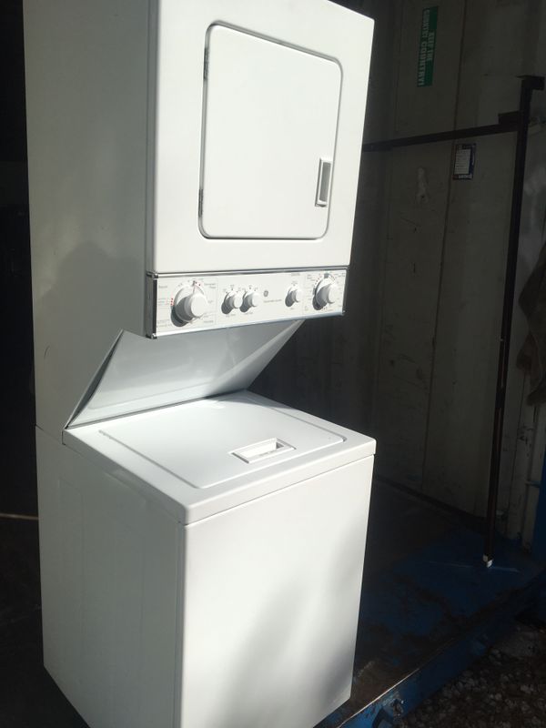 GE 24" WIDE STACKABLE COMBO WASHER DRYER WORKS PERFECT HAS DENT ON TOP