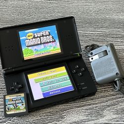 Black Nintendo DS in excellent condition with Mario game, complete with stylus & charger. $75