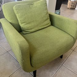a modern simple style green armchair upholstered in linen