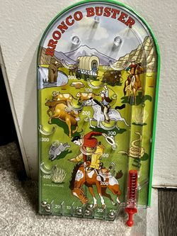 vintage early 2000s Bronco Buster hand held pinball game, western theme game by Schylling