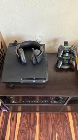 PS3, 2 wireless controllers with charging station and 30 games