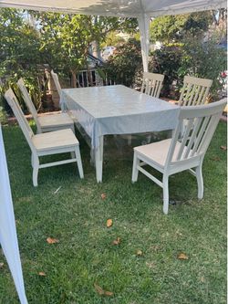 Solid wood 6-chair dining set in good condition.
