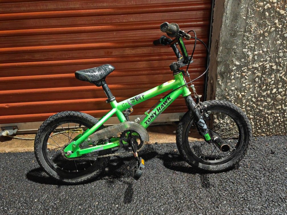 green Tony Hawk BMX-style boy's bicycle.
