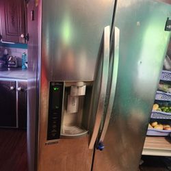 Lg Refrigerator And Samsung Stove Range. 