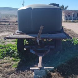 1100 Gallon Gravity-Feed Water Tank on Hay Trailer w/ Spray Bar & Hose - Off-Grid Ready!