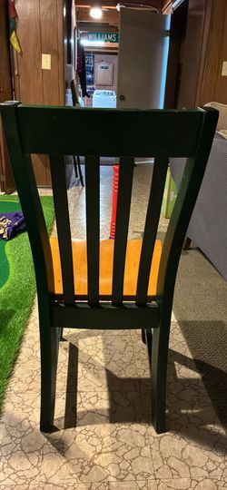 Two wooden And Green chairs 