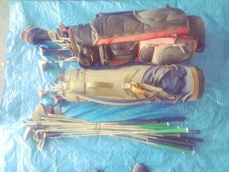 51 assorted golf clubs and two bags