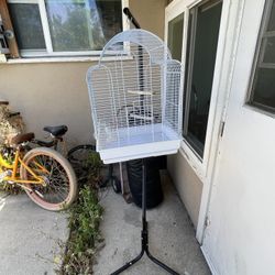 Bird Cage With A Stick That Can Hold The Cage 