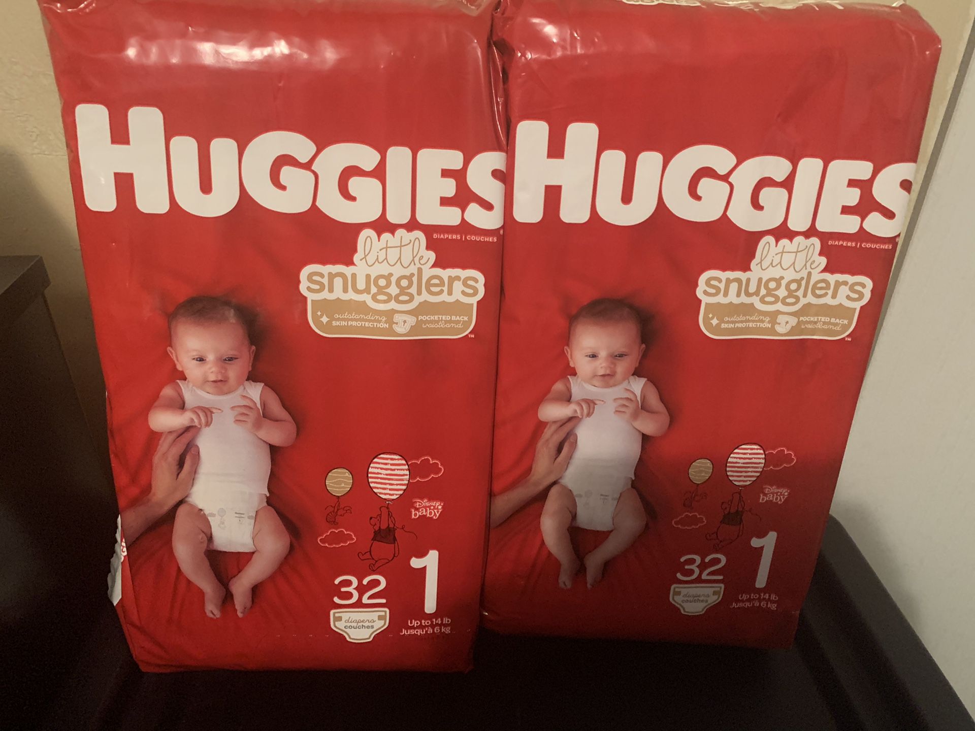 2 bags Huggies little snugglers size 1 32 ct. Each.