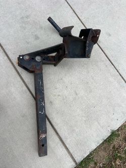 Torklift camper tie down system featuring a hitch-mounted design
