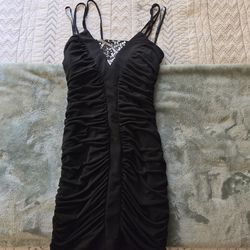 Black ruched bodycon mini dress with a rhinestone/embellished front panel, size small
