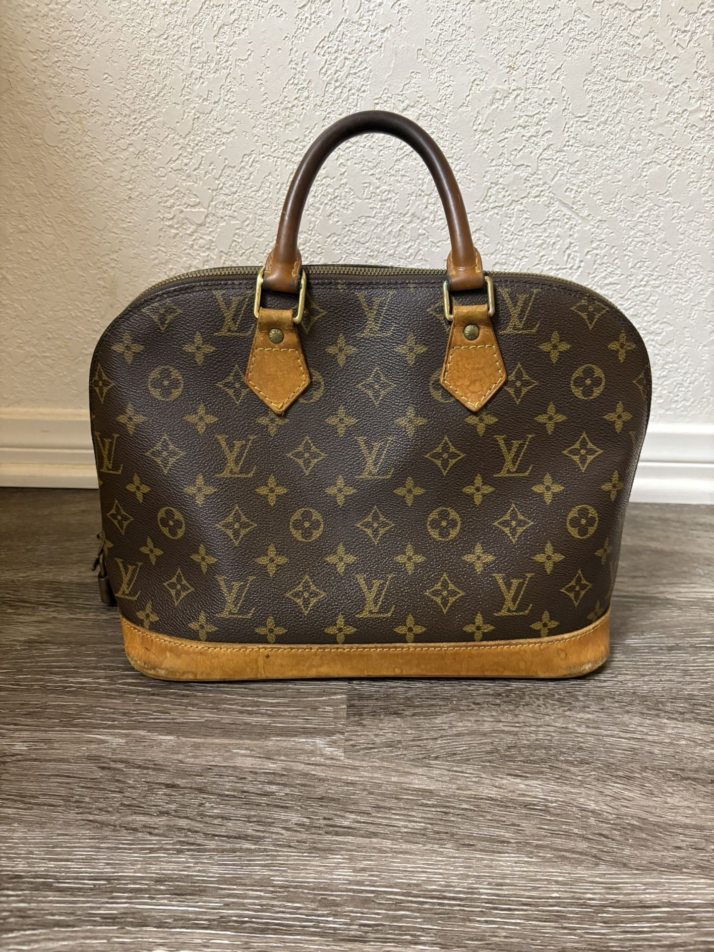 Louis Vuitton Alma Handbag