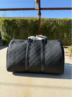 Black LV duffel bag