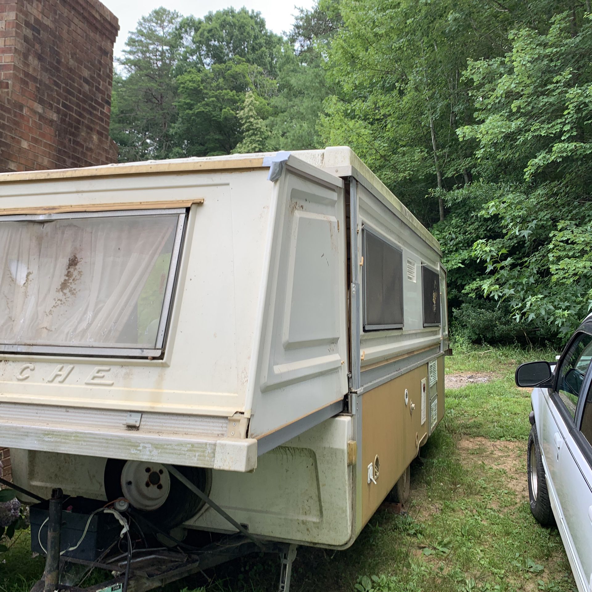 Apache hard sided camper 13 feet closed and 24 feet open needs cleaning and recover cushions