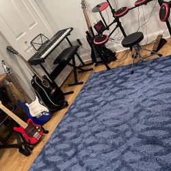 Children instruments, set of drums, electric keyboard, fender, guitar, electric guitar, electric bass FAO Schwartz, electric guitar