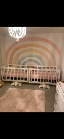 Two white Target baby and toddler cribs with Newton baby mattresses
