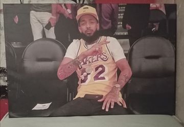 Nipsey Hussle at Lakers game wearing Lakers jersey photograph on canvas