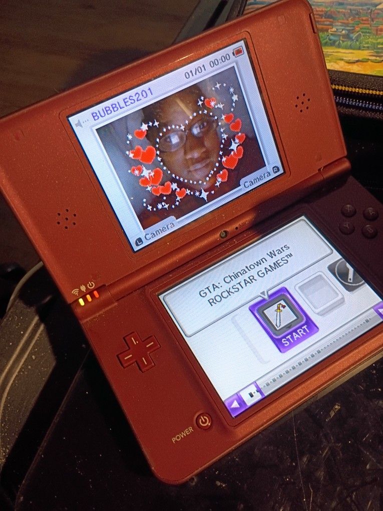 NINTENDO DSI XL HAND HELD GAMING SYSTEM BRONZE UTL-001 WITH GAME GRAND THEFT