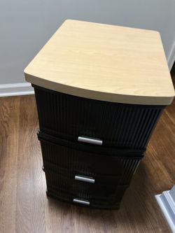 An old, vintage , with wood top, 3 draws, plastic storage