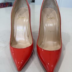 Christian Louboutin patent leather red pumps