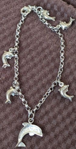 Two real silver dolphin bracelets