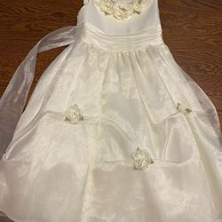 Ivory and white dresses .  Sweater.